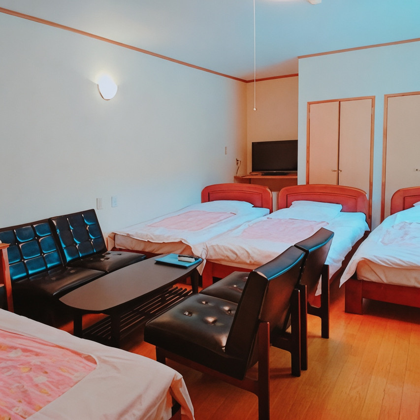Guest room with multiple beds.