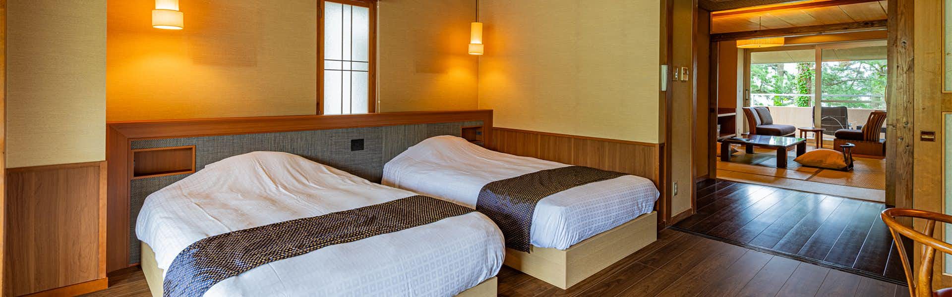 Tokiichiyu with a modern twin bedroom with dark timber accents.