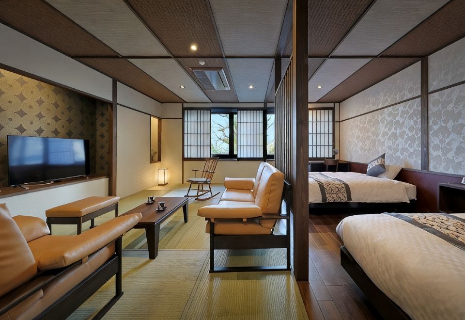 A modern twin room with a tatami seating area.
