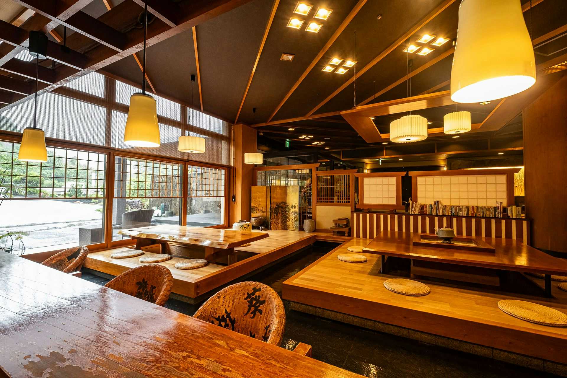 Seseragi no Yado Kuretake with a polished timber lobby with tables and hanging lights.