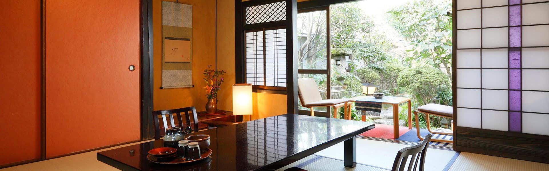 Kurashiki Bikan District Yoshi Ryokan with a traditional tatami guest room overlooking a quiet garden.