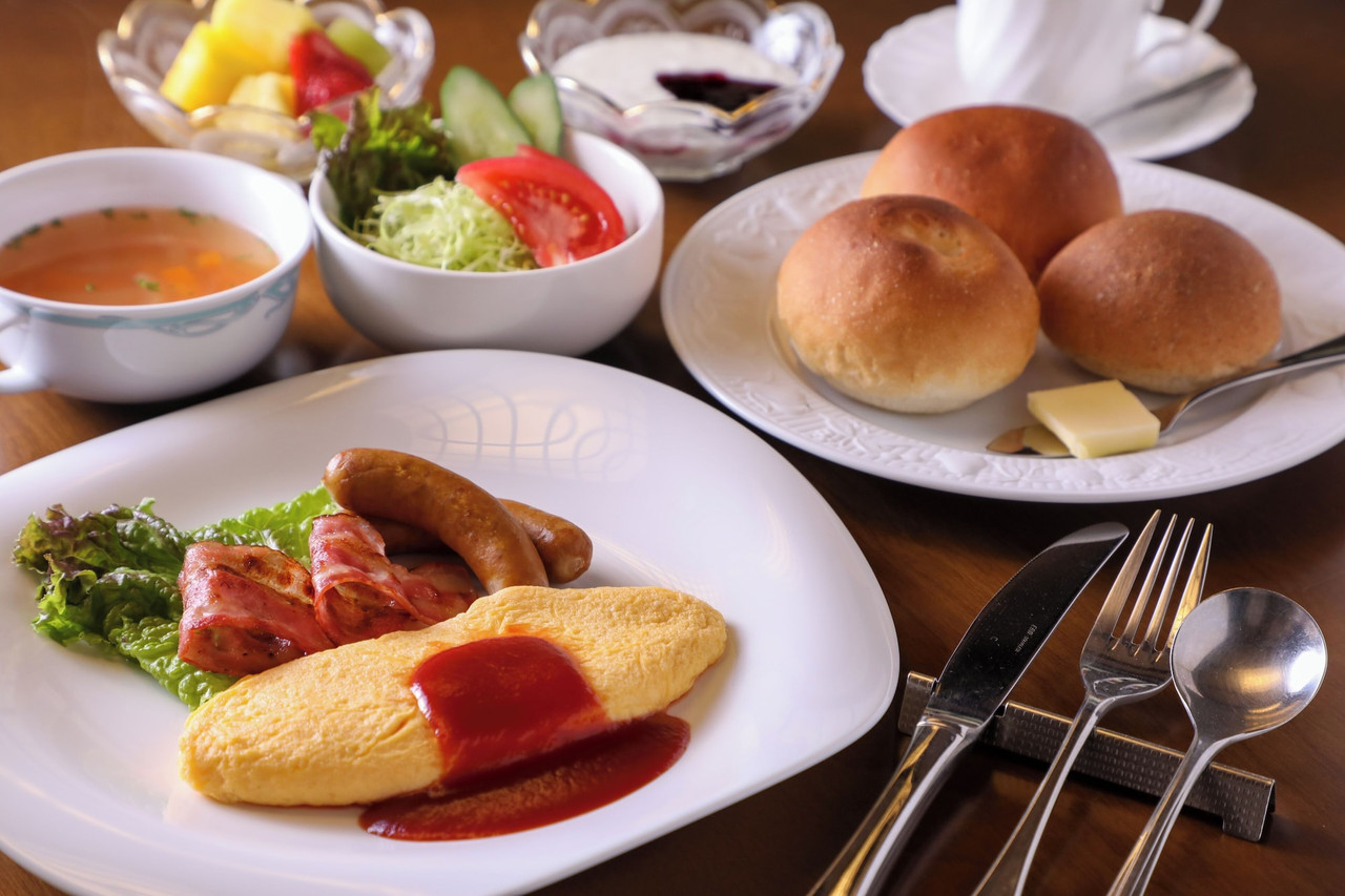 Breakfast with bread and side dishes.