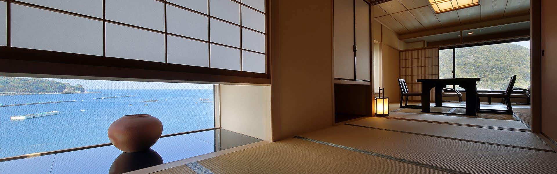Shoutoukan with this scene, where its tatami guest room frames the bay and distant mountain through a picture window.