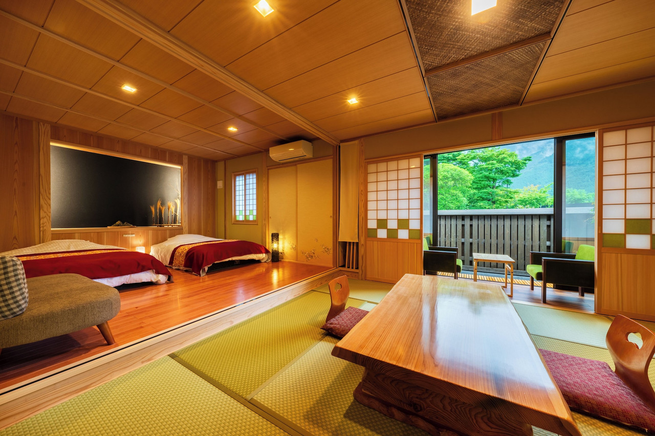 Japanese-style guest room with beds.