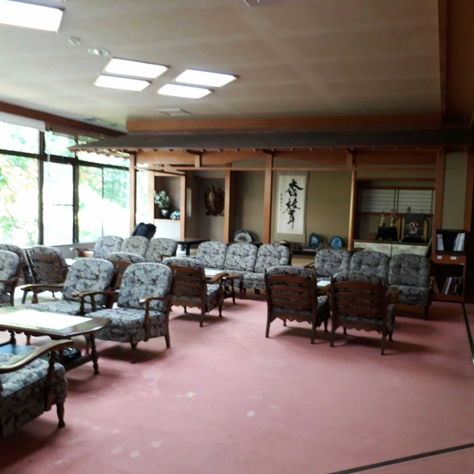 Carbonated Spring Inn Niko Niko Sou with a spacious lobby furnished with rows of upholstered chairs.