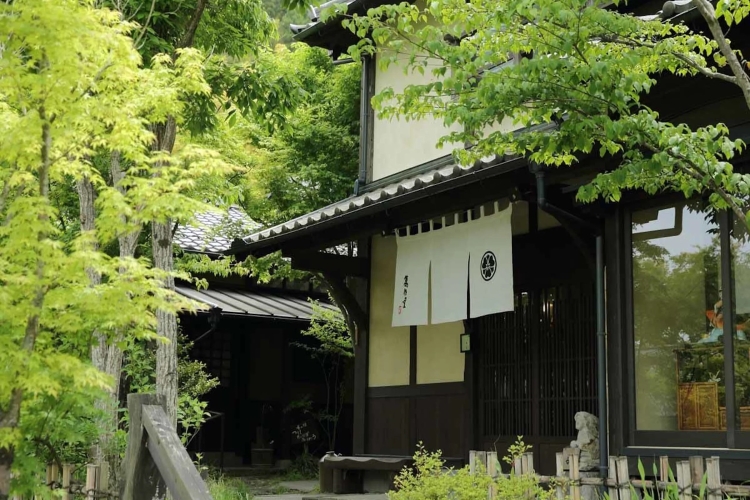 Historic main-house exterior amid the inn’s greenery.