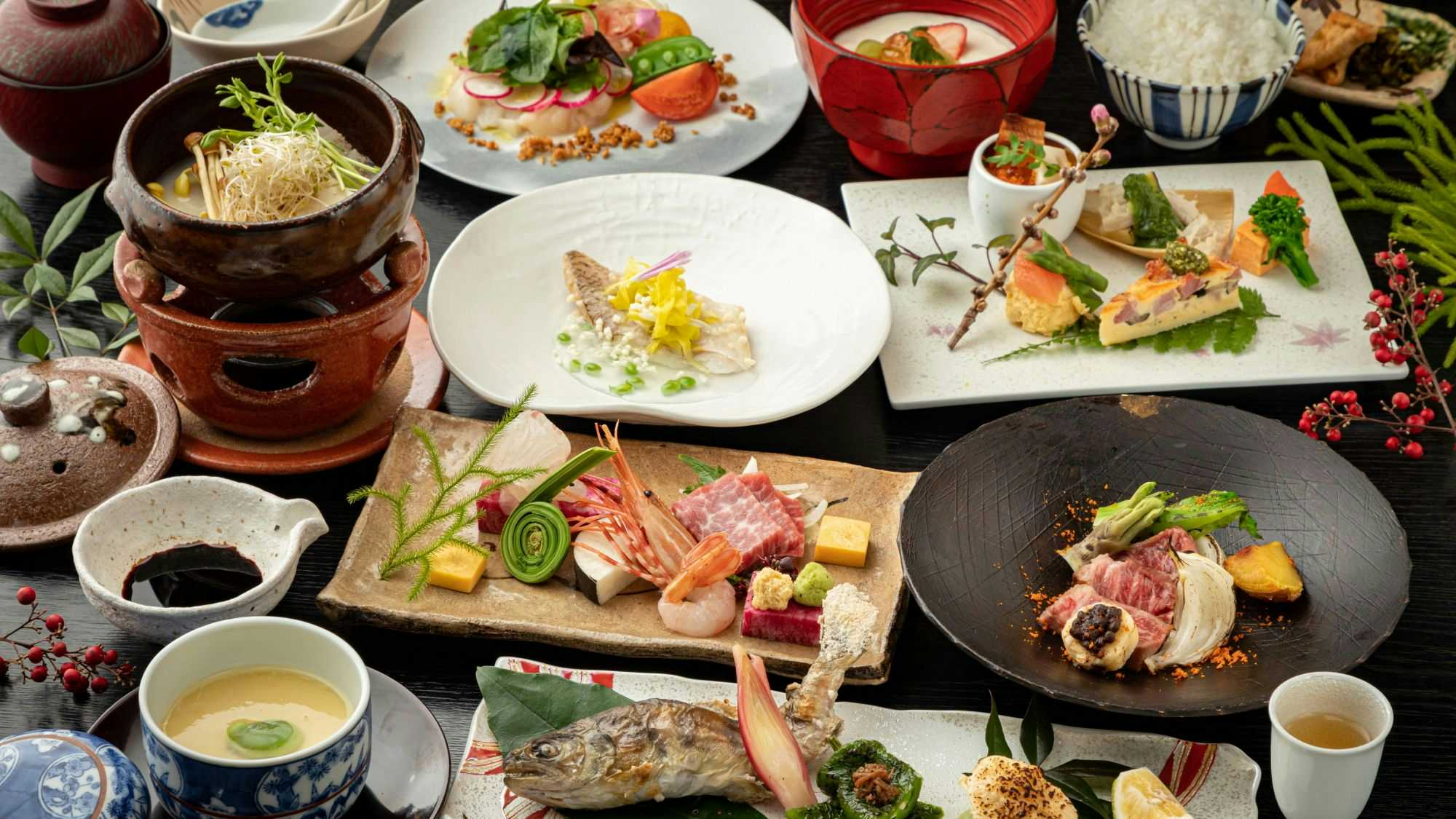 Kurokawa Onsen Ikoi Ryokan with this scene, where many small seasonal dishes, sashimi and grilled items fill the dinner table.