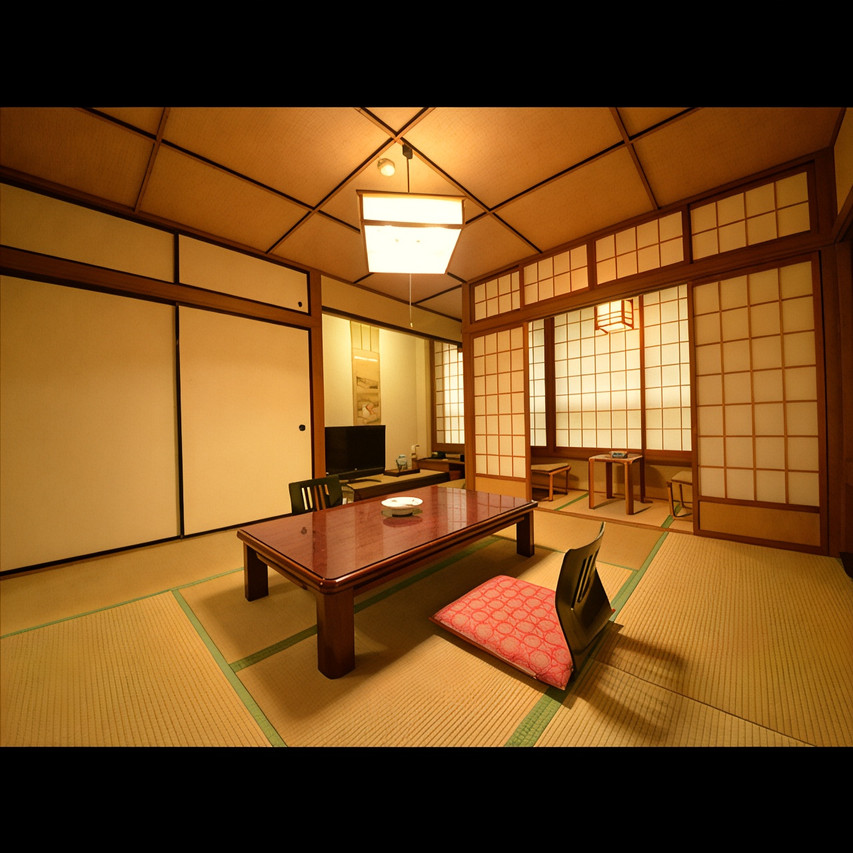Tatami room with a low table and floor cushion.