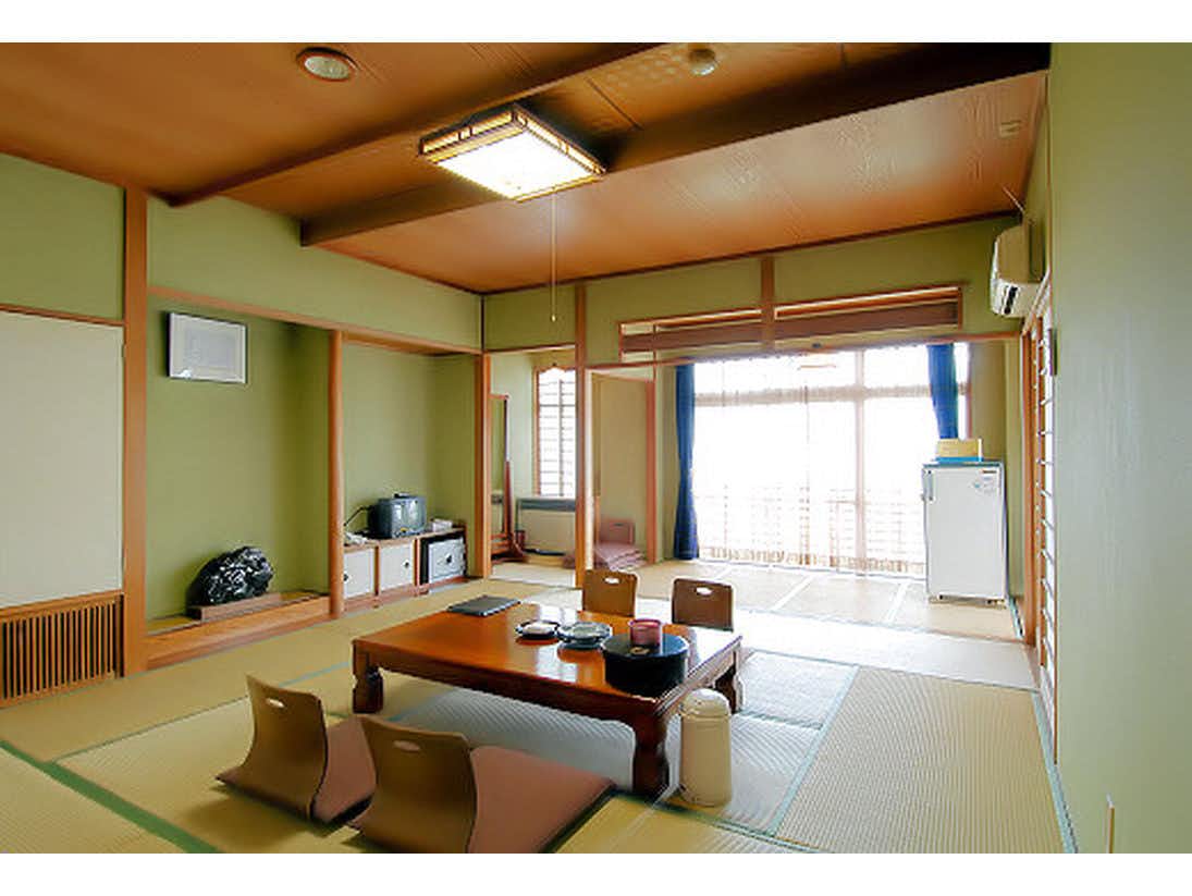 Ikaho Onsen Ryokan Fukuzenn with a traditional tatami room with low table and window seating.