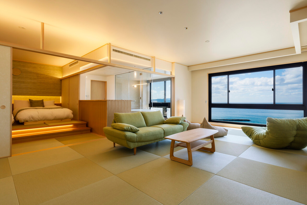 Guest room with seating and a wide window.