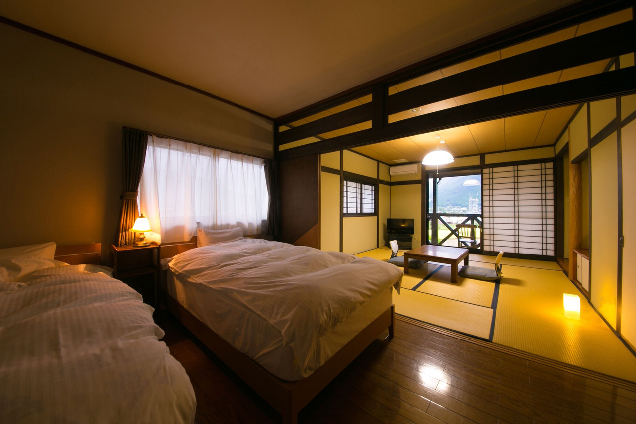 Guest room with beds and a low table.