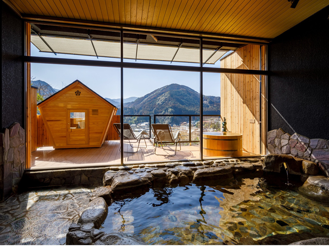 A private-looking bath overlooks the mountain settlement.