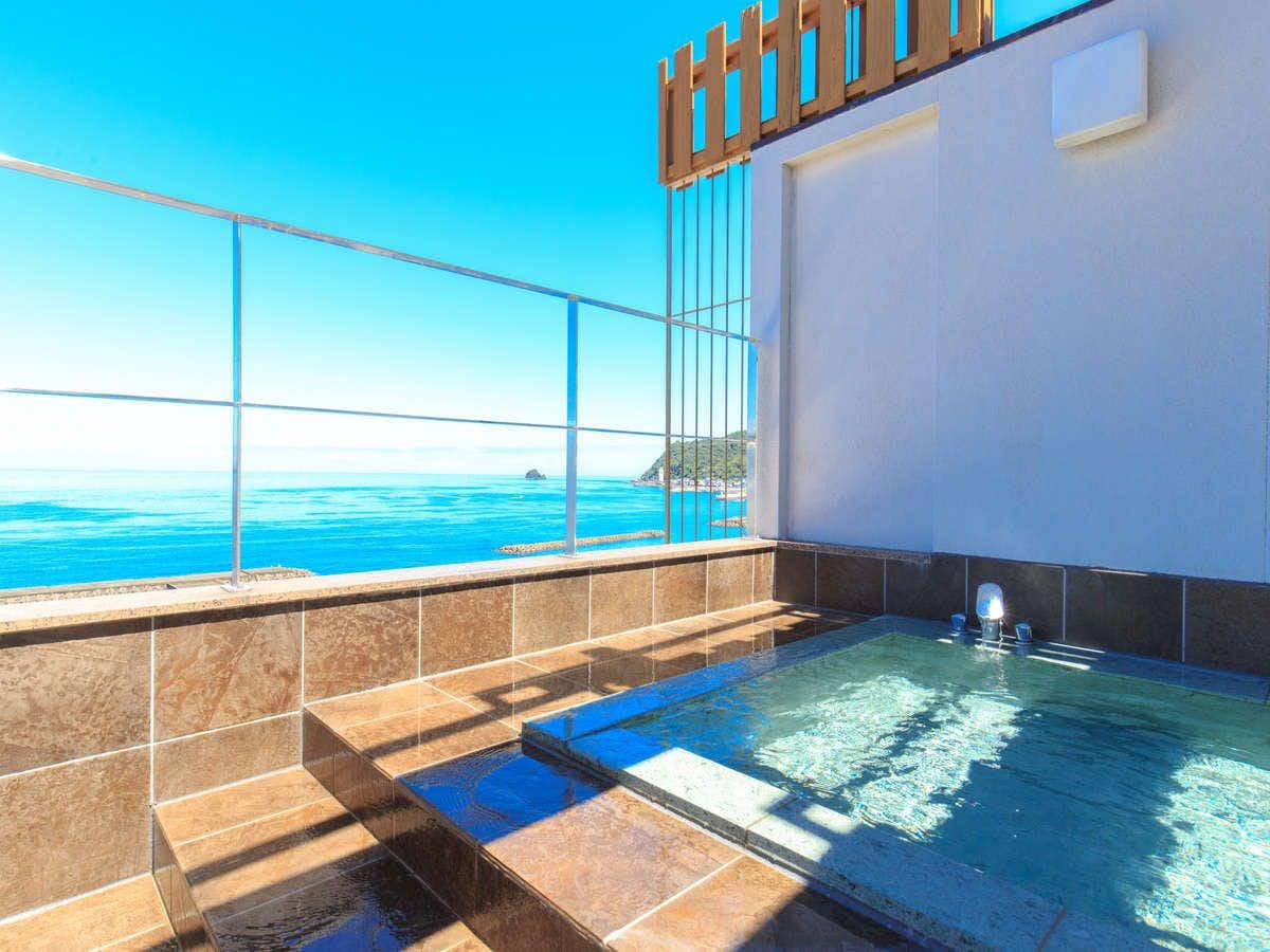 Kameya Rakan with a rooftop bath overlooking the bright blue coastline.