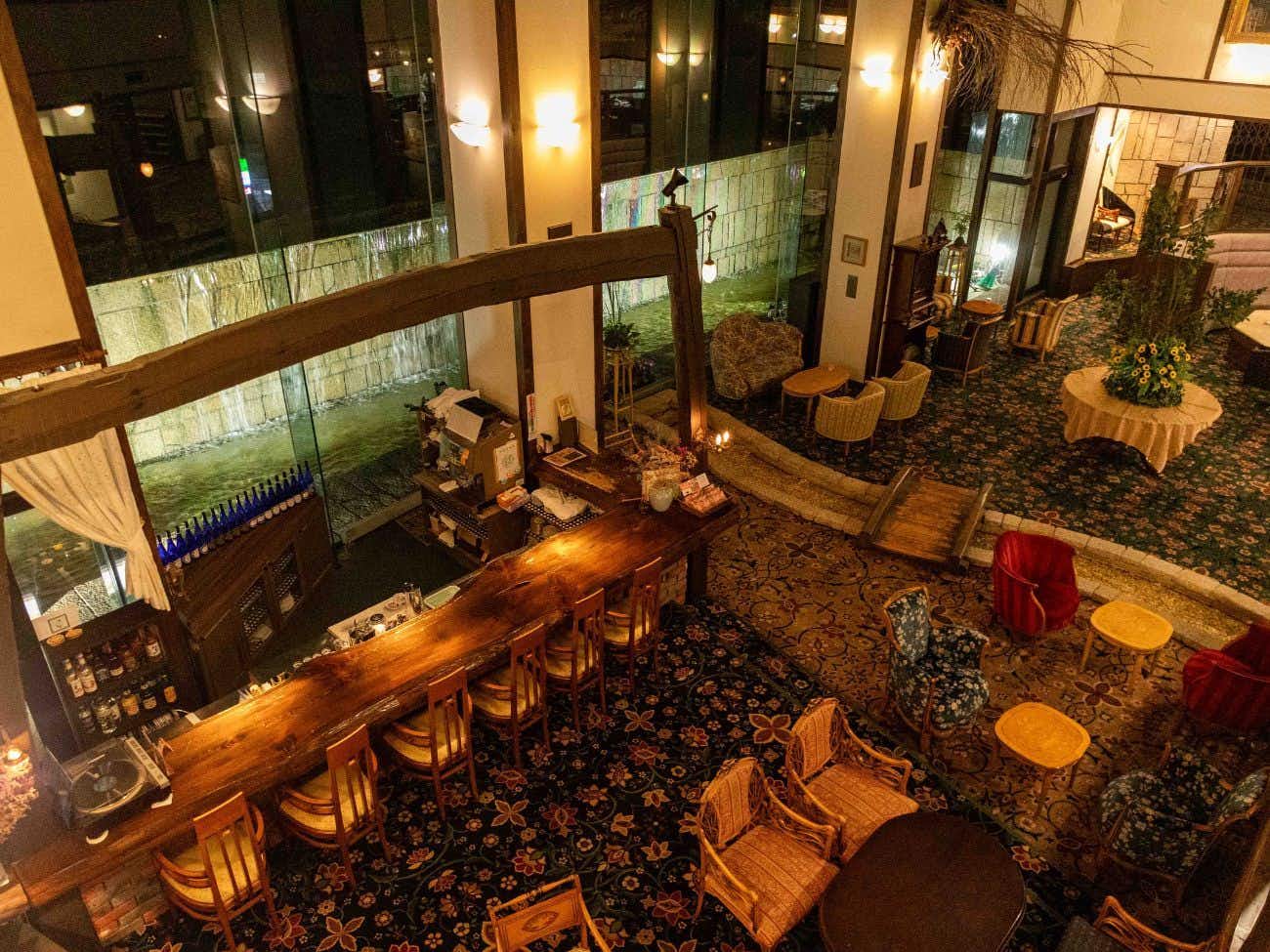 Sasara with a dramatic lobby overlooking illuminated city lights.