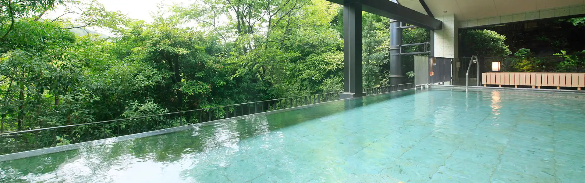 Satoyama Villa Shimoda Central Hotel with this scene, where its outdoor bath mirrors the surrounding treetops.