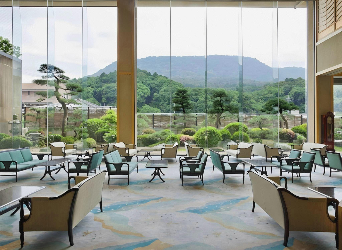 Dining area with large windows and garden views.