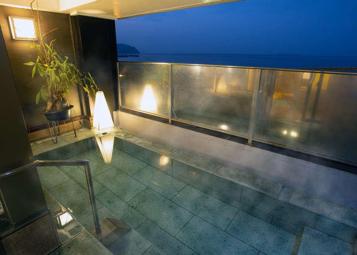 Kameya Rakan with a private stone bath reflecting soft evening light.