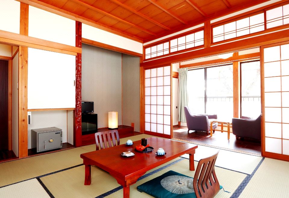 A traditional room with a low table and sliding screens.