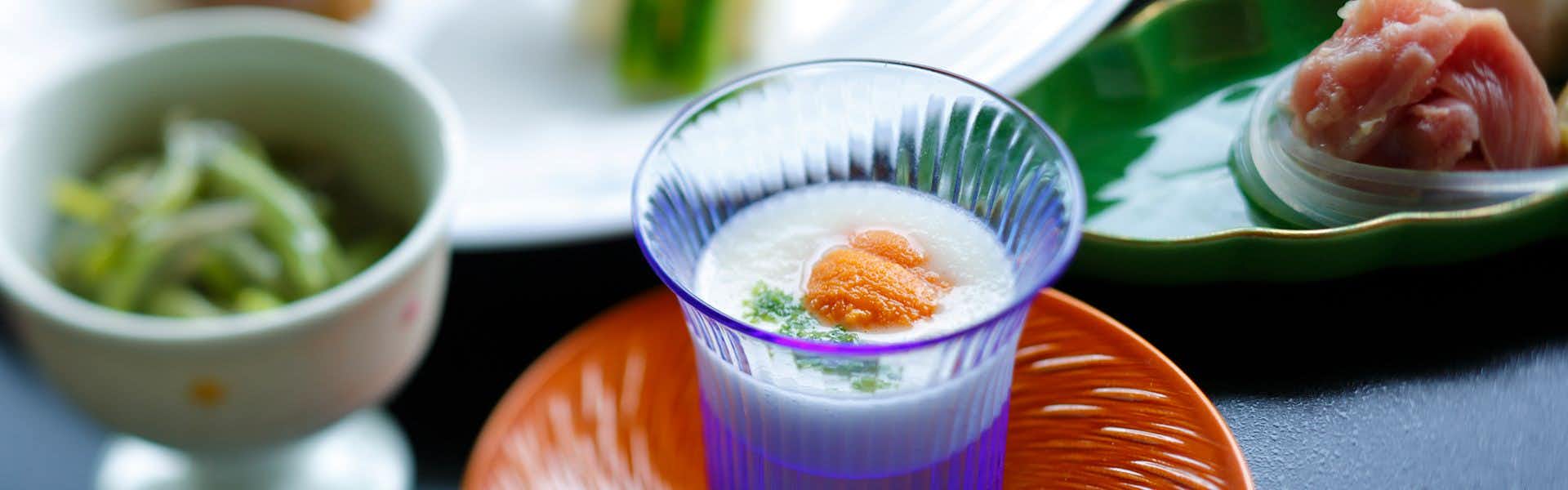 Arima Onsen Negiya Ryofukaku with delicate appetizers presented on red and blue ceramics.