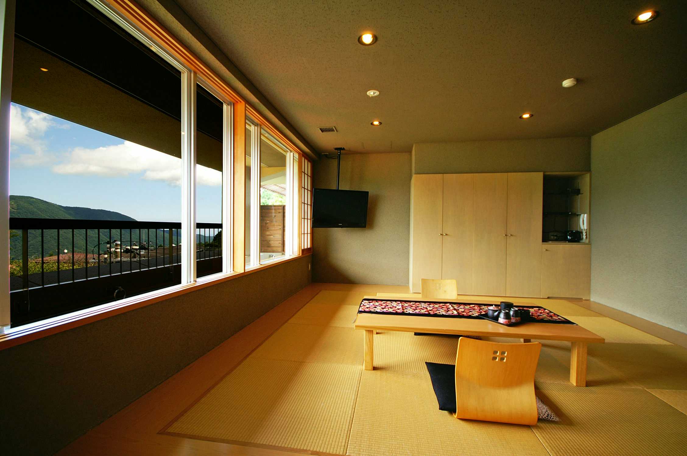 Gora Nigori no Yuyado Nounou Hakone with a contemporary tatami room overlooking layered mountain scenery.