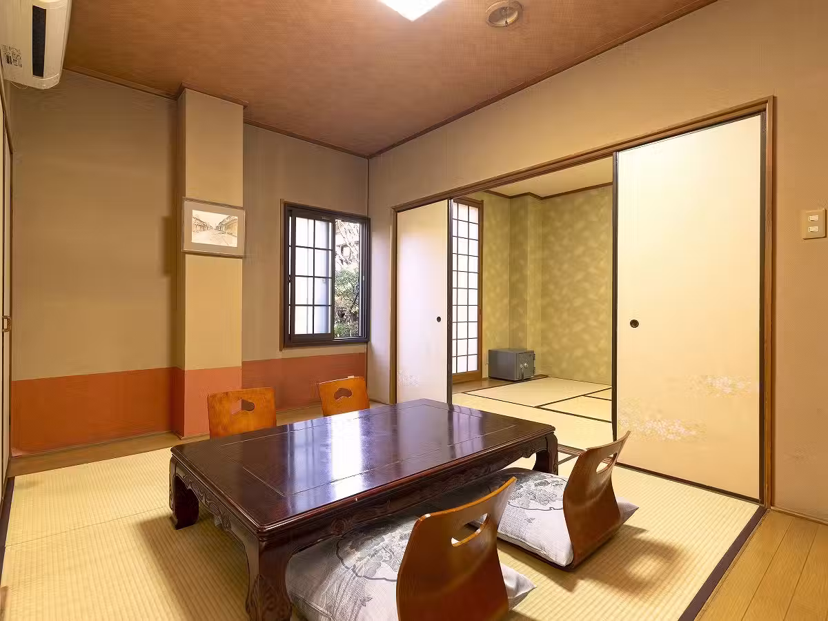 Hotaru no Yado Sendou with this scene, where a traditional tatami guest room centers on a low lacquer table.
