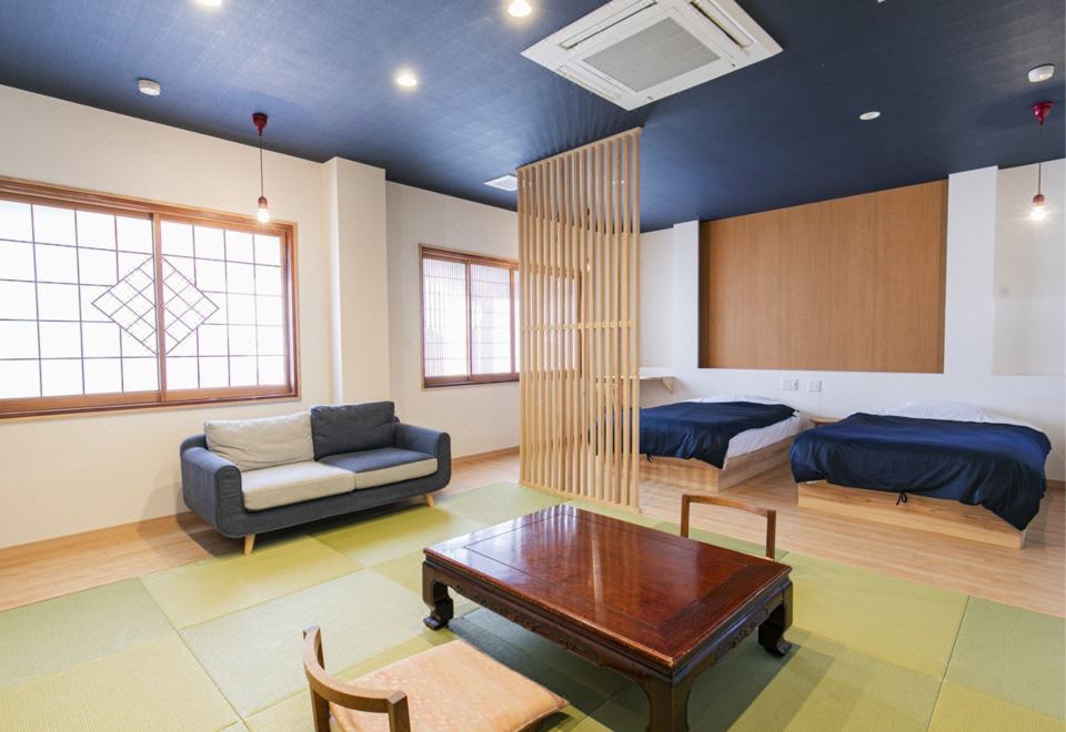A bright room is arranged beside a compact indoor bath.