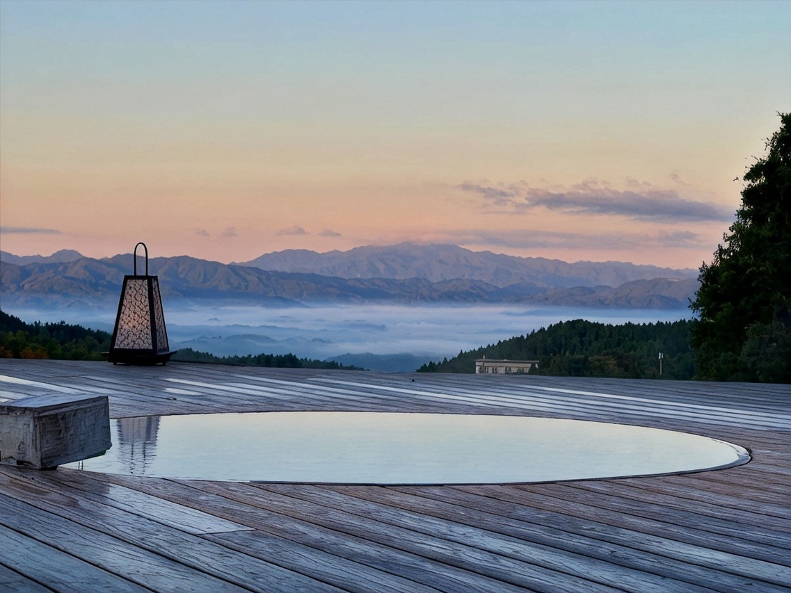 An outdoor bath facing a broad landscape.