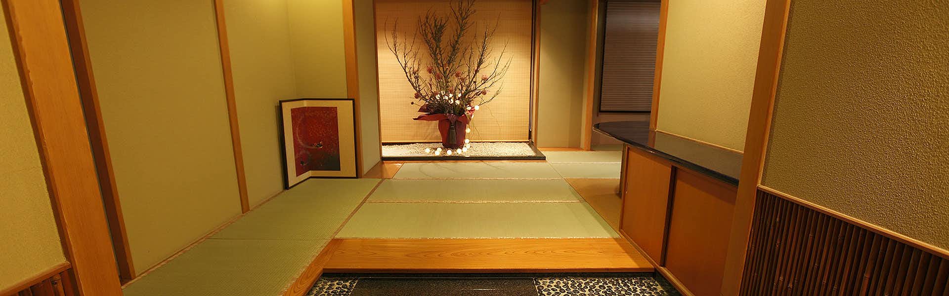 Toi Fujiya Hotel with a traditional guest room with tatami flooring and alcove.