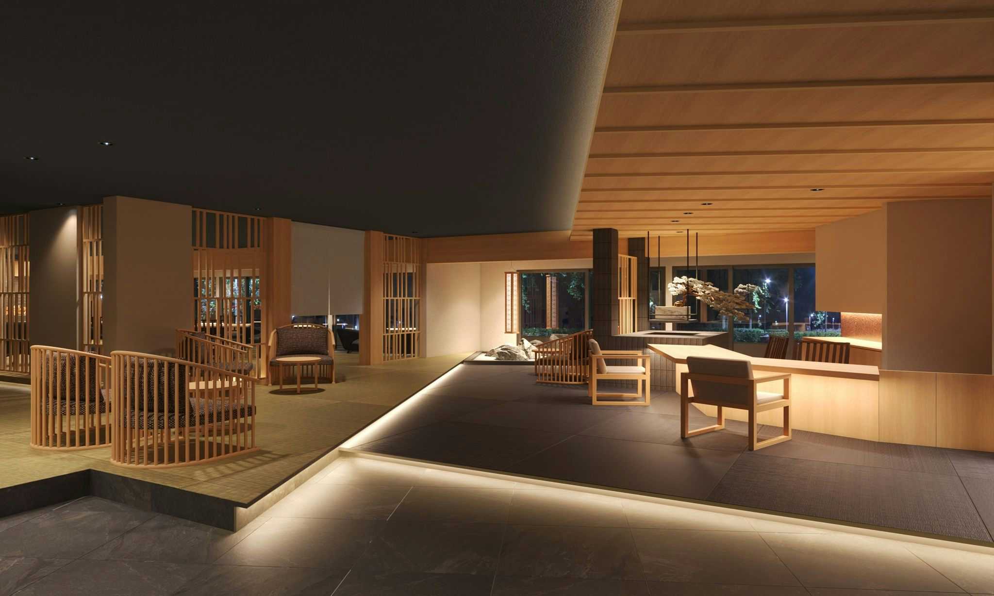 Satsuki Onyado with a minimalist lobby with timber seating and polished floors.